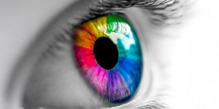 Eye with iris in rainbow colors.