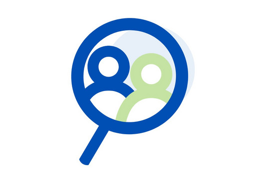 An icon with two people inside a magnifying glass.