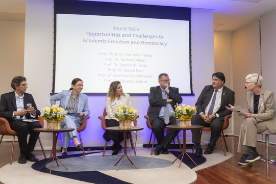Participants in a panel discussion