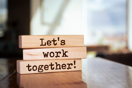 Three wooden beams with text on them