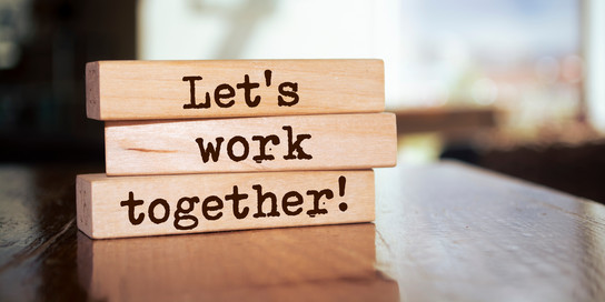 Three wooden beams with text on them