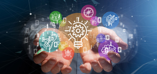 Photo-graphic collage with open hands covered with colorful symbols from science and technology