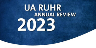 Blue background with the words “UA Ruhr Annual Review 2023”