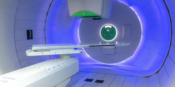 Proton therapy device in a treatment room.