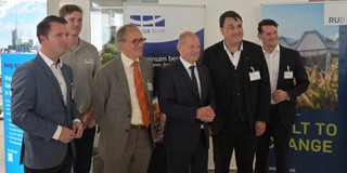 Group of men in suits, including Chancellor Olaf Scholz