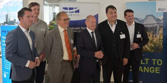 Group of men in suits, including Chancellor Olaf Scholz